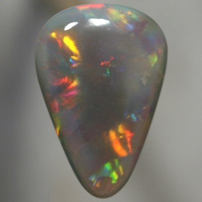 SOLID SEMI BLACK OPAL Bright rolling flashes, orange, green and purple